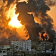 A fire rages at sunrise in Khan Yunish following an Israeli airstrike on targets in the southern Gaza strip, early on May 12, 2021.